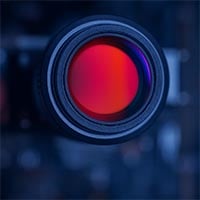 infrared sensor lens used in IR detection devices, showcasing red and purple optical glass