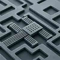 MEMS Device microelectromechanical system (MEMS) device fabricated from thick silicon wafer with clearly visible etched microchannels.