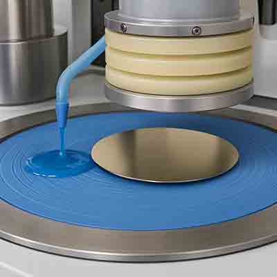 Semiconductor wafer on a polishing pad with slurry applied during wafer lapping and CMP